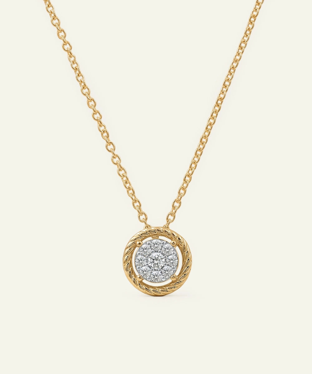 Gold necklace with a round pendant on a light beige background