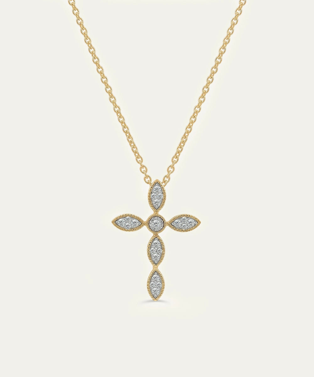 Gold necklace with a cross pendant on a light gray background