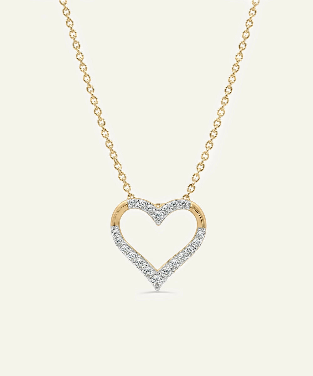 Heart-shaped diamond necklace on a light beige background
