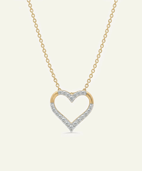 Heart-shaped diamond necklace on a light beige background