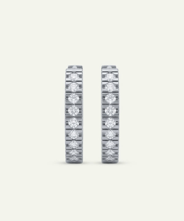 Pair of diamond eternity bands on a light gray background