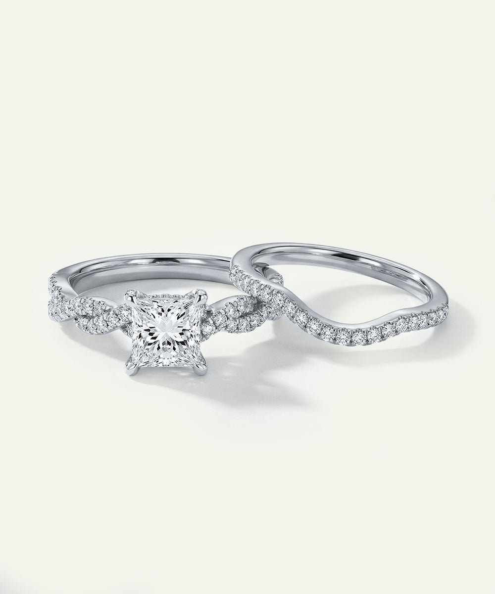 Two diamond rings on a light gray background