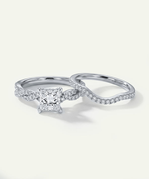 Two diamond rings on a light gray background