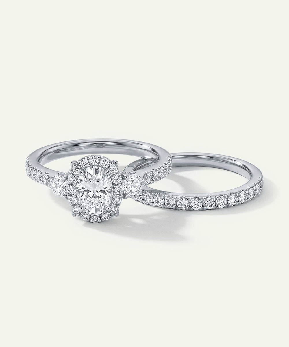 Pair of diamond rings on a light gray background
