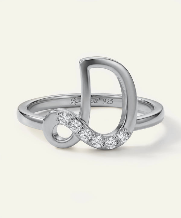 Silver ring with infinity symbol and diamond accents on a white background