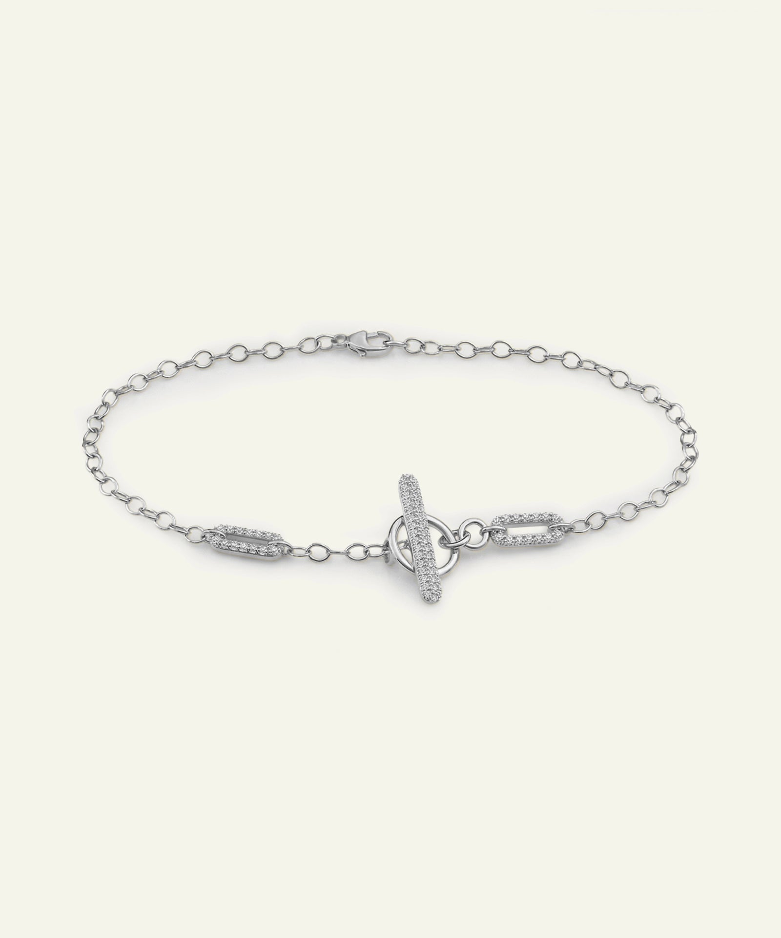Silver bracelet with a unique clasp design on a white background