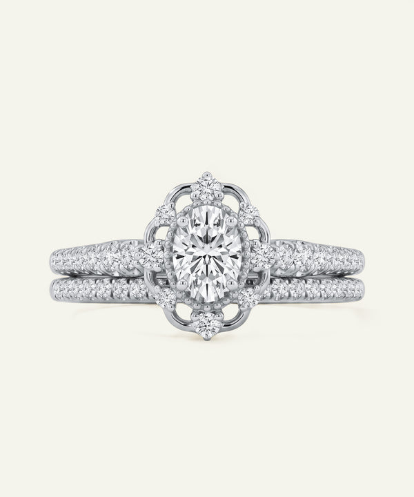 Diamond ring with intricate design on a light gray background