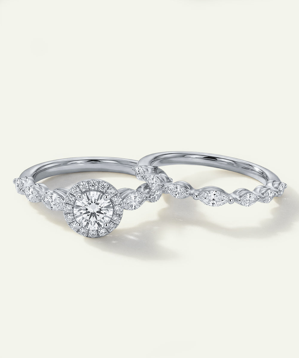 Two diamond rings on a light gray background