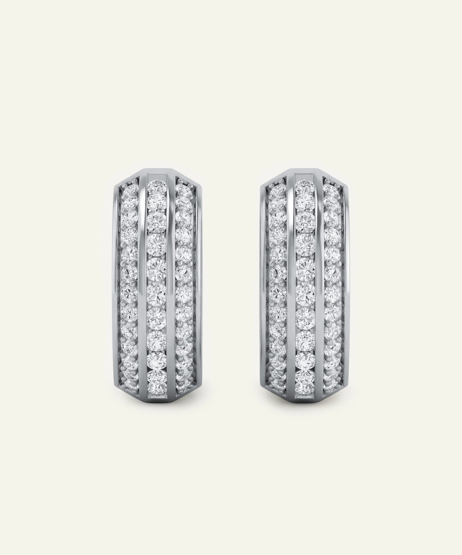 Pair of diamond earrings on a light gray background