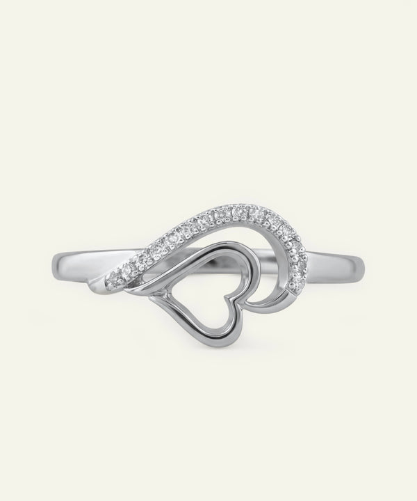 Silver ring with a heart design on a white background