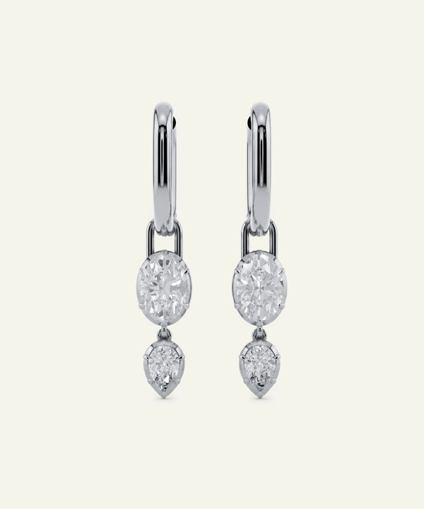 Pair of diamond earrings on a white background
