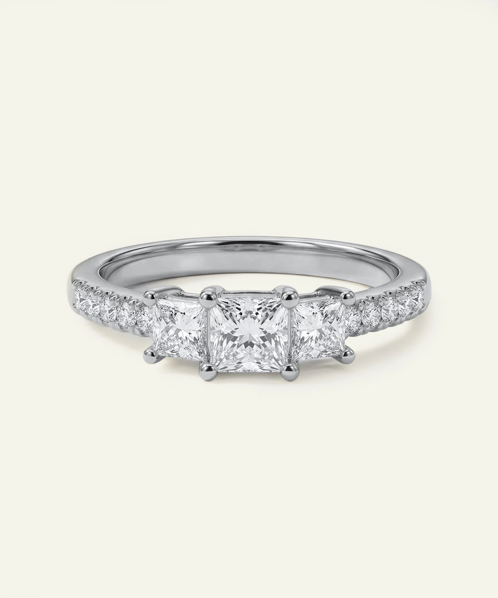 Diamond ring with four-prong setting on a white background