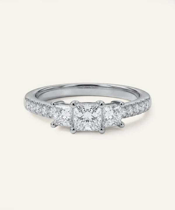 Diamond ring with four-prong setting on a white background