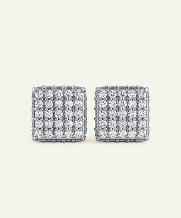 Pair of square-shaped earrings with clear gemstones on a light gray background