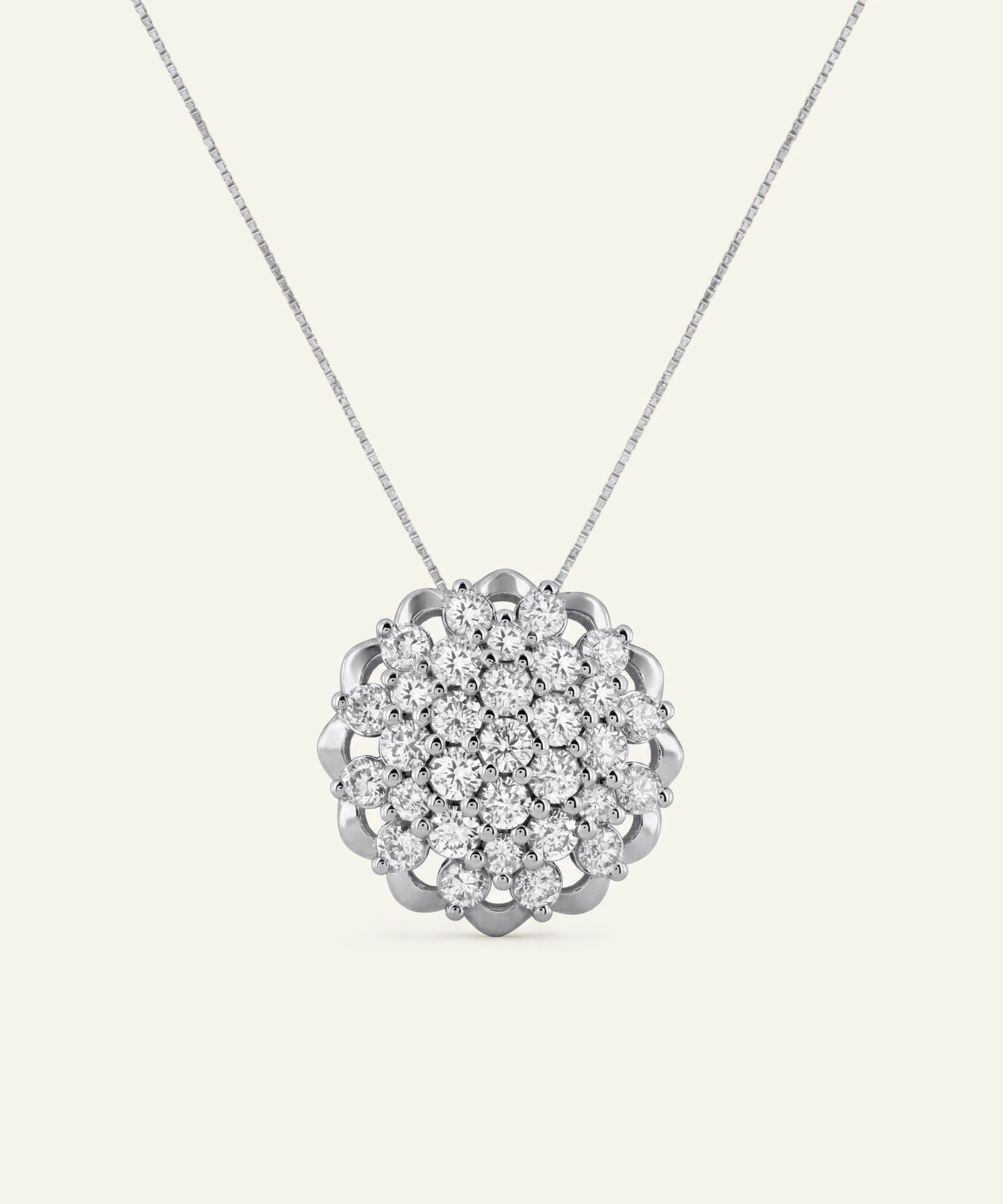 Silver necklace with a floral diamond pendant on a white background