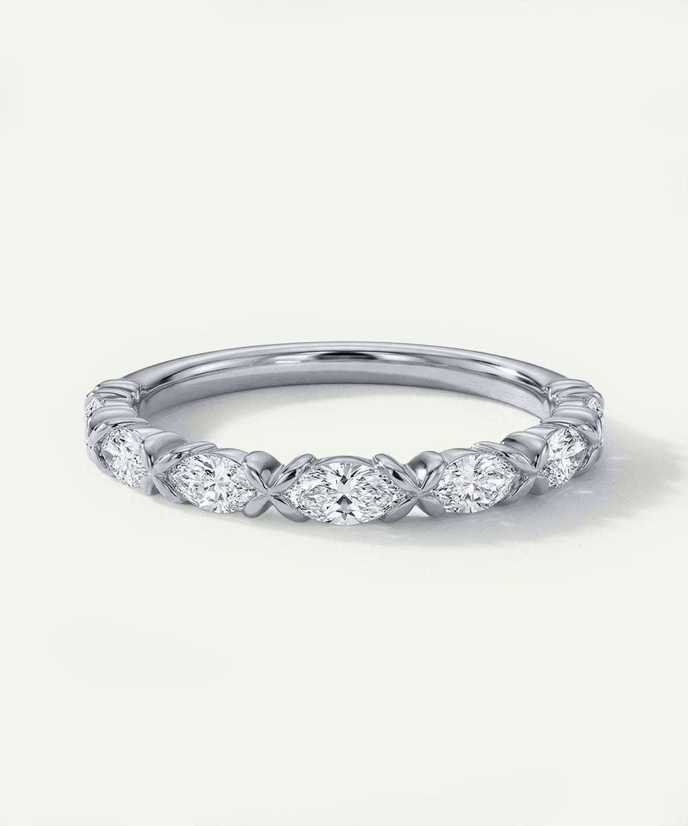 Silver ring with diamond accents on a white background