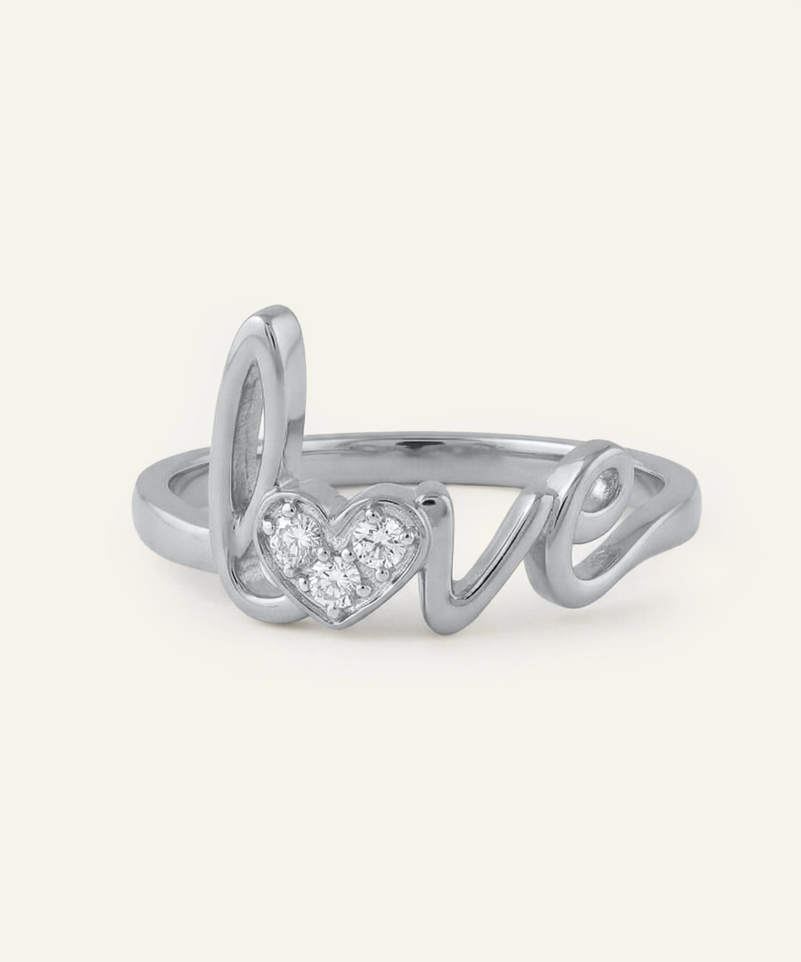 Silver ring with 'love' and heart design on a white background