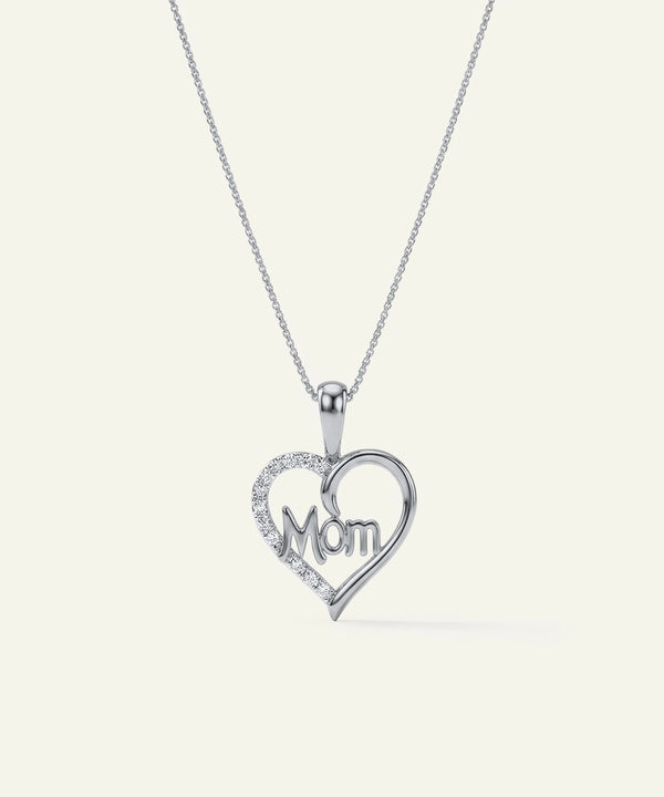Heart-shaped pendant with 'Mom' engraving on a white background