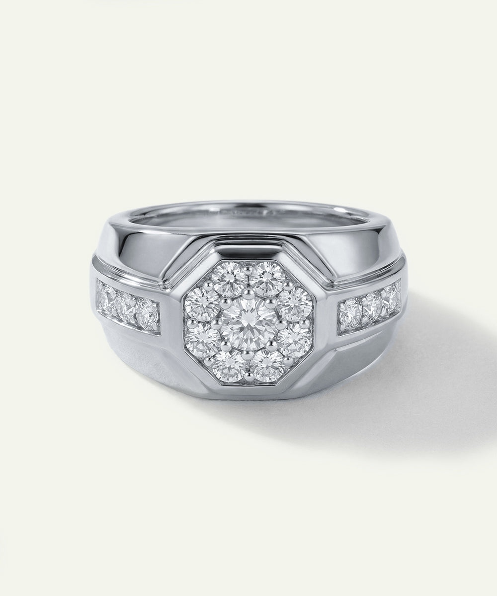 Silver ring with diamond accents on a white background