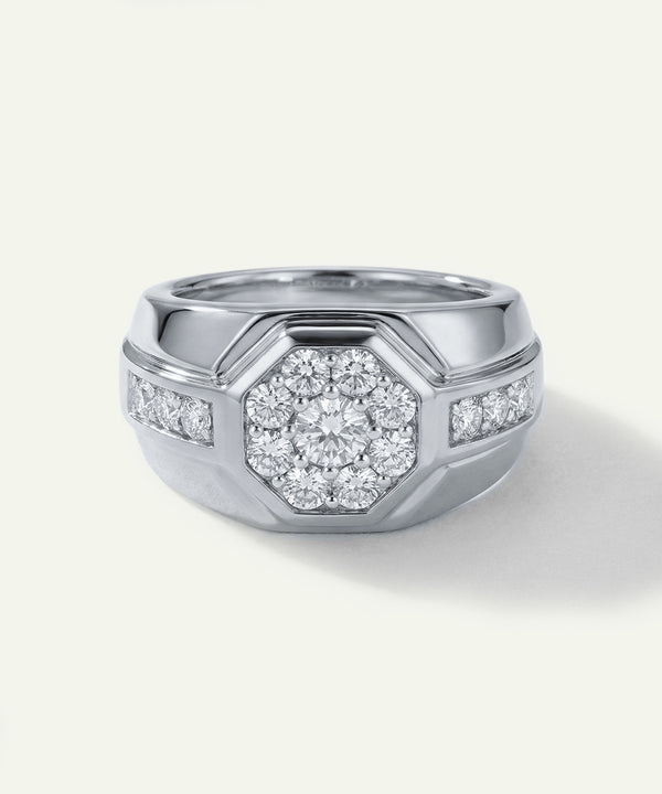 Silver ring with diamond accents on a white background