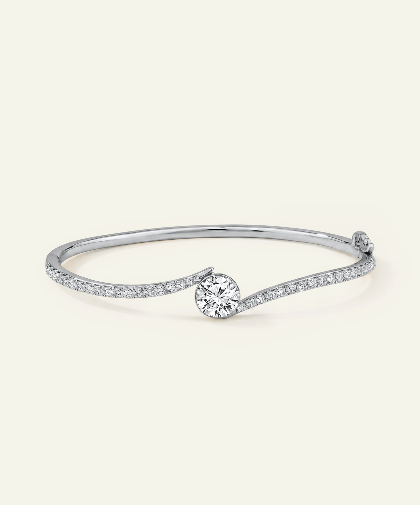 Silver bracelet with a central diamond on a white background