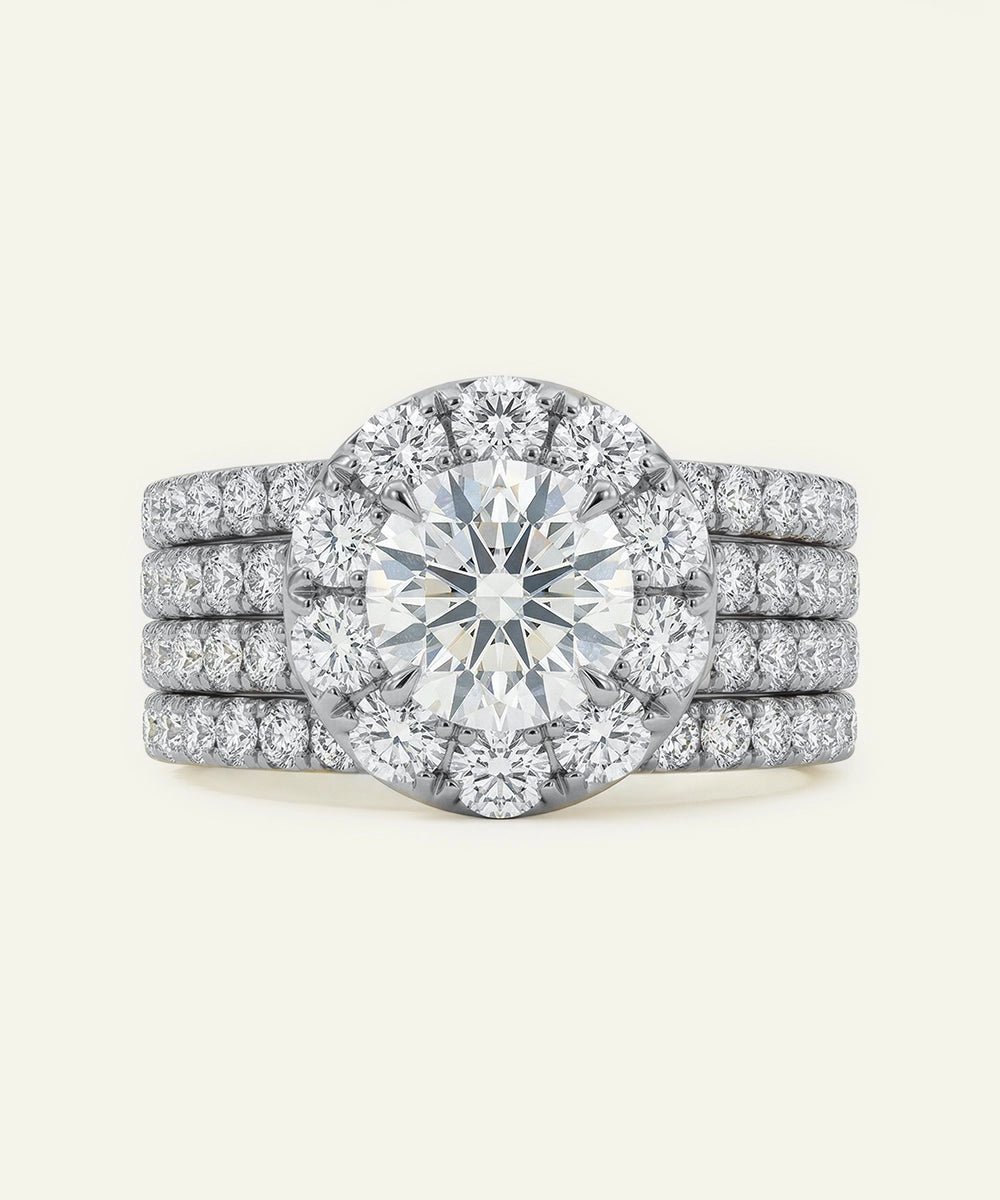 Diamond ring with a halo and multiple stones on a white background