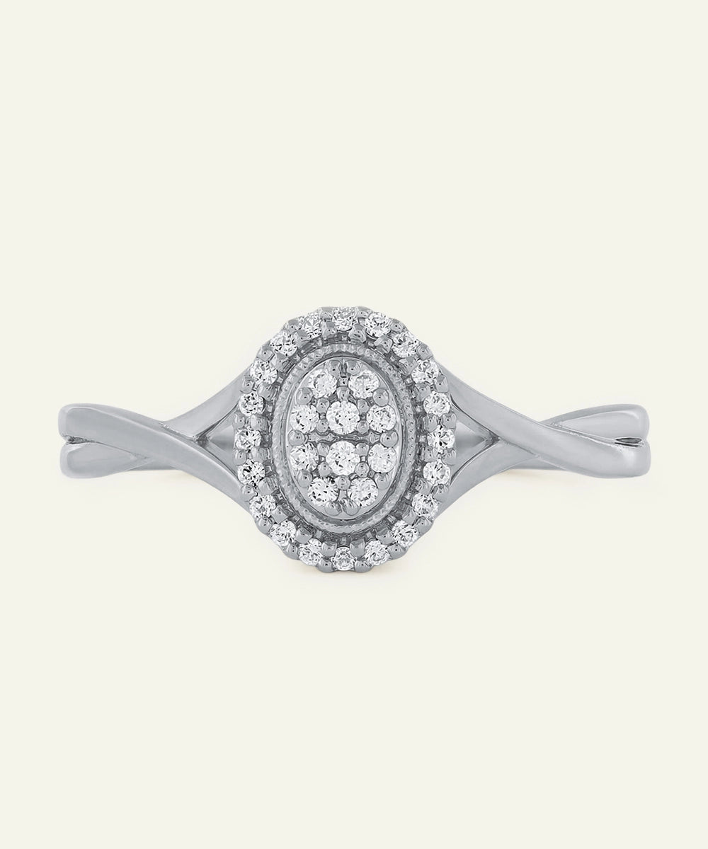 Silver ring with diamond accents on a white background