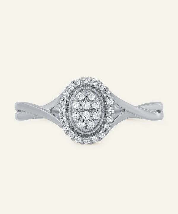 Silver ring with diamond accents on a white background
