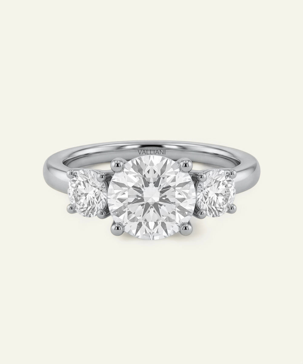 Three-stone diamond ring on a white background