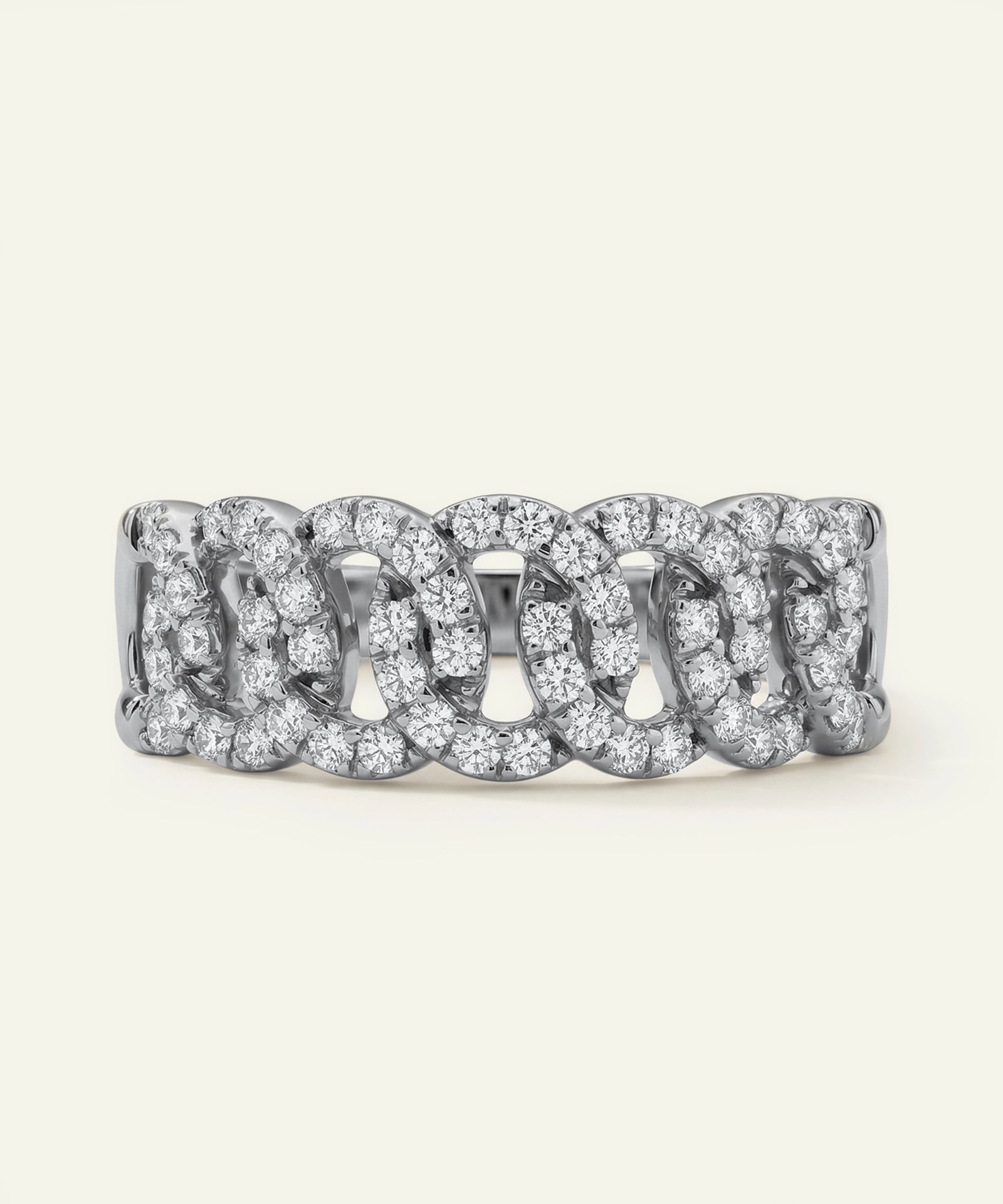 Silver ring with diamond accents on a white background