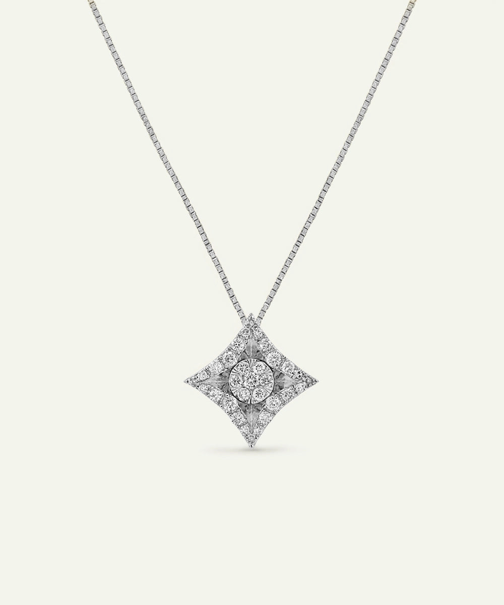 Diamond necklace with a star-shaped pendant on a light gray background
