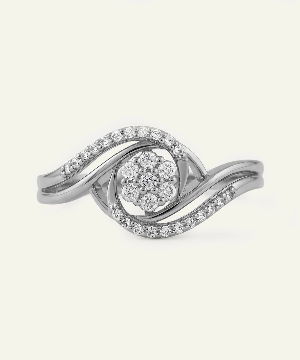Silver ring with diamond accents on a white background