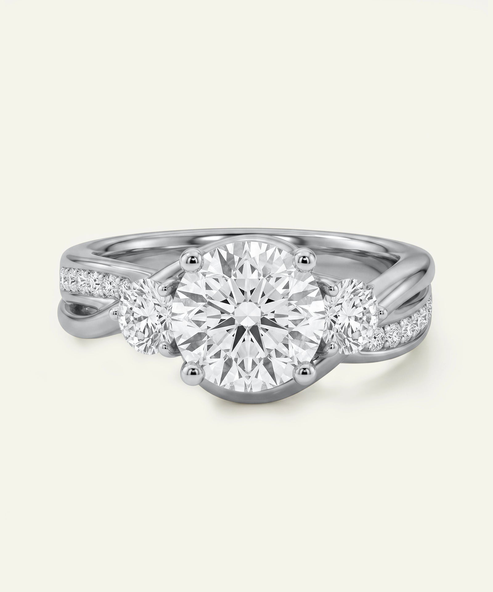 Diamond ring with three circular diamonds on a light gray background