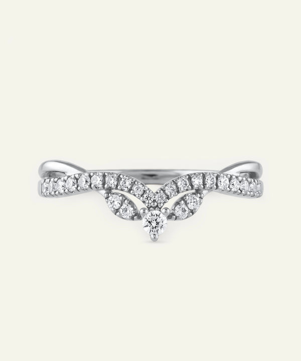 Delicate silver ring with small diamonds on a white background