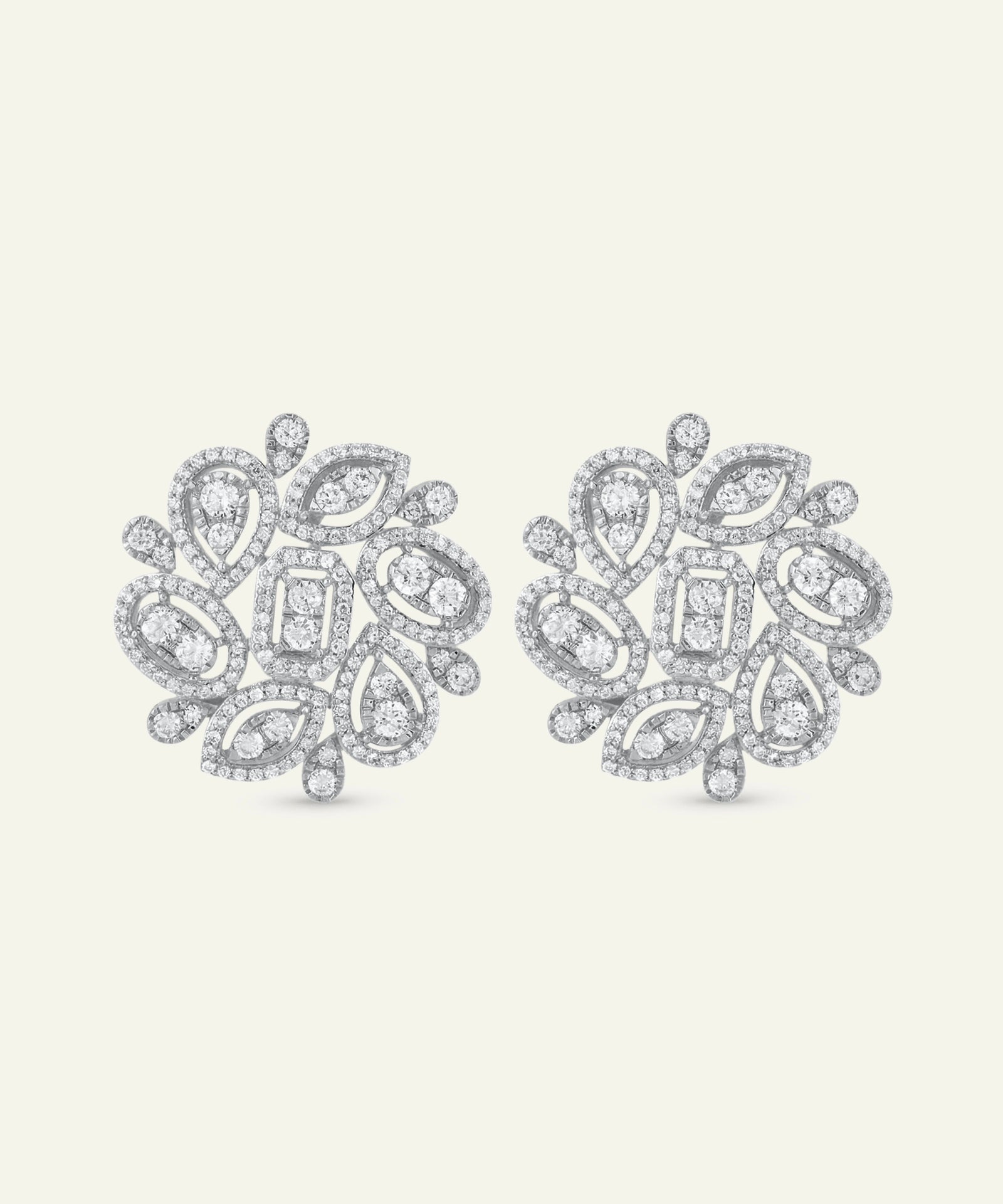 Pair of diamond earrings on a light gray background