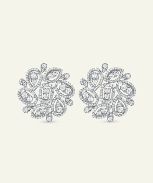 Pair of diamond earrings on a light gray background