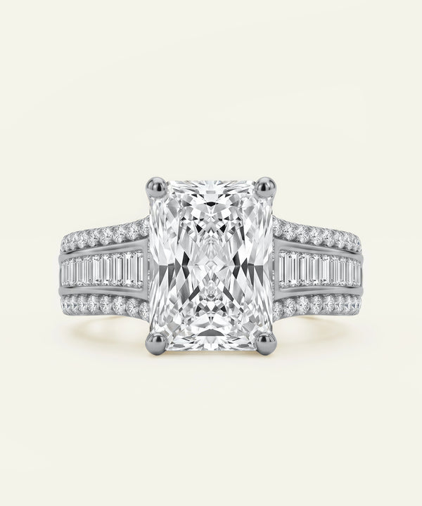 Diamond ring with a large central gemstone and smaller stones on a light background