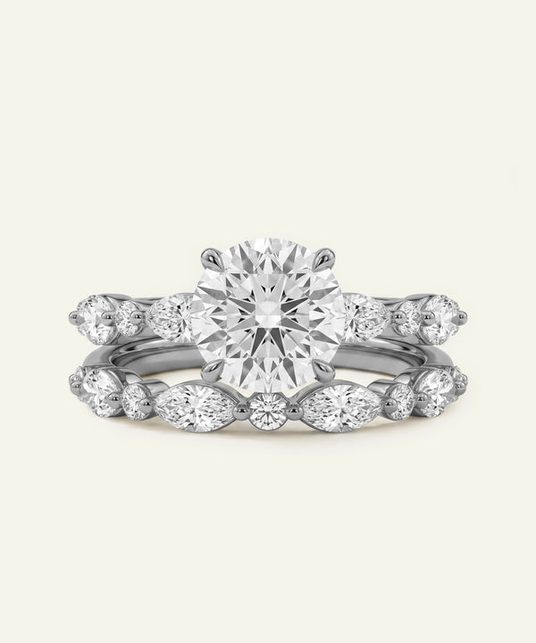 Diamond ring set on a light gray background