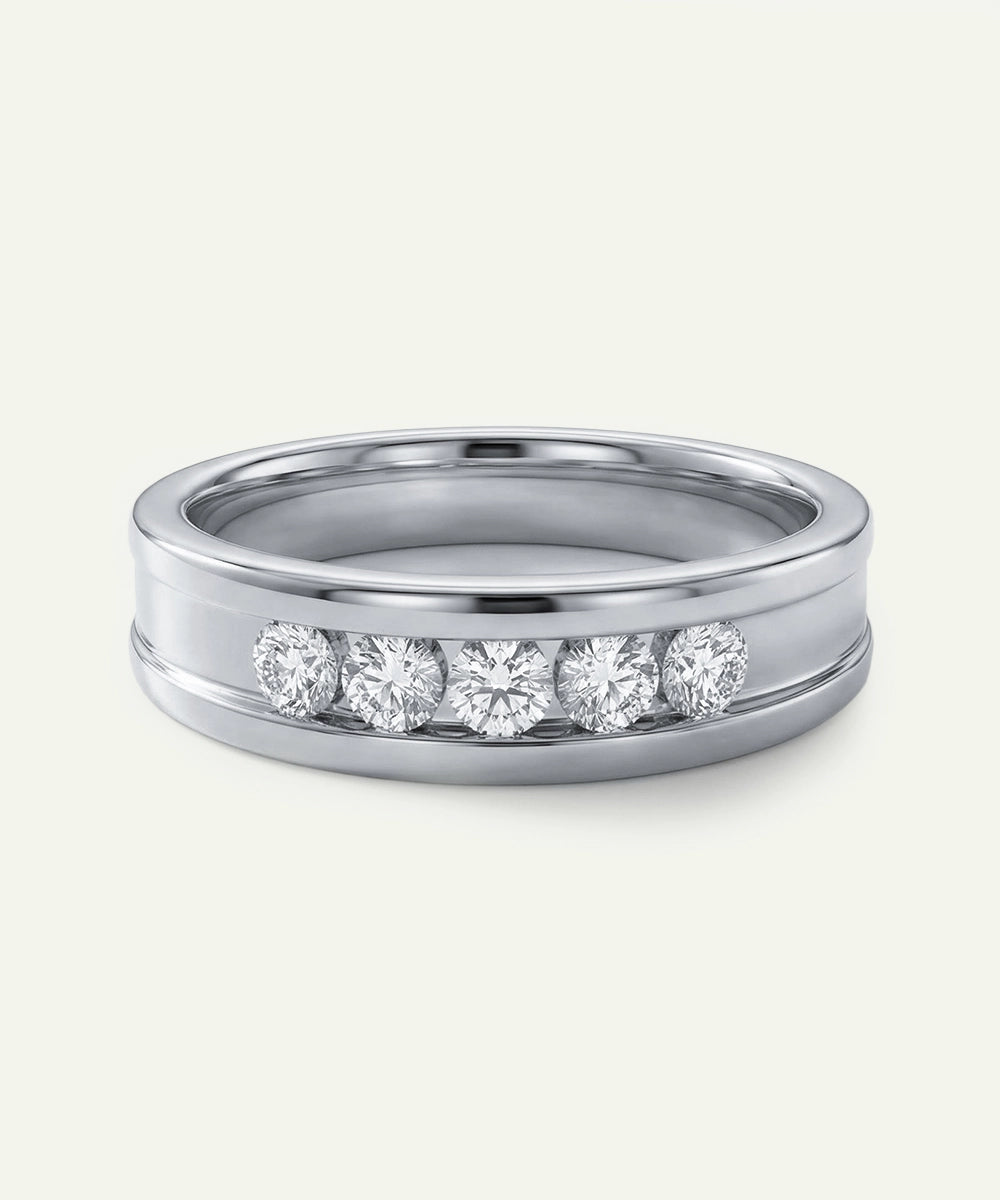 Silver ring with embedded diamonds on a white background
