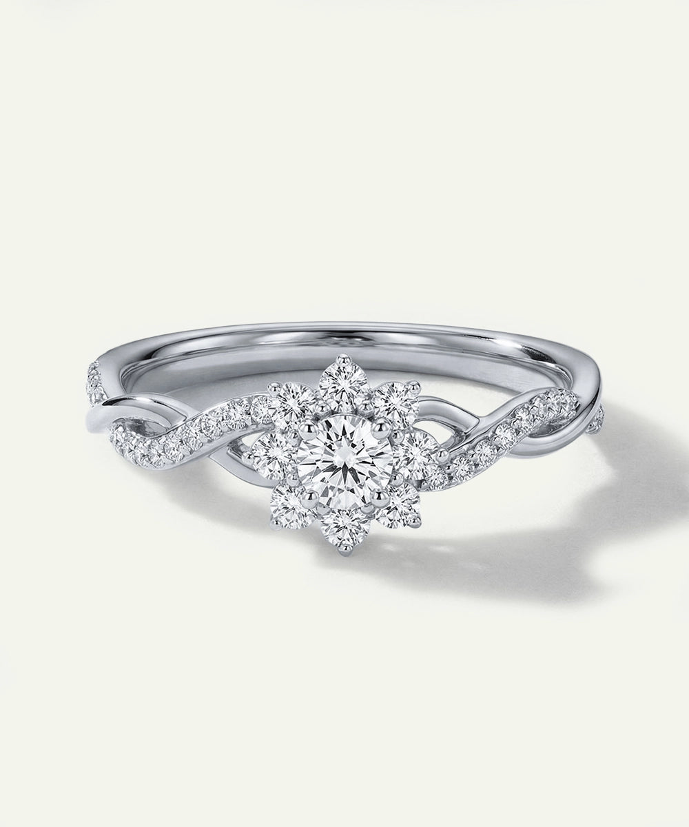 Silver ring with a diamond on a light gray background