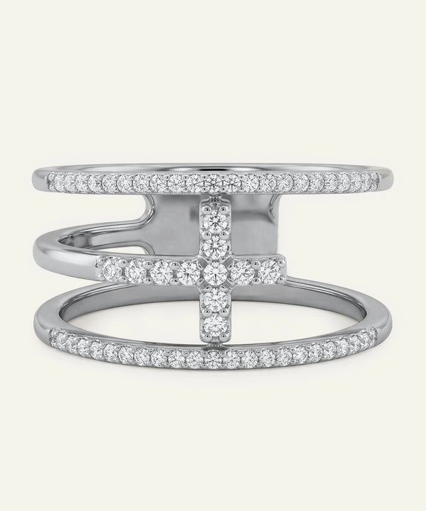 Silver ring with diamond accents on a white background