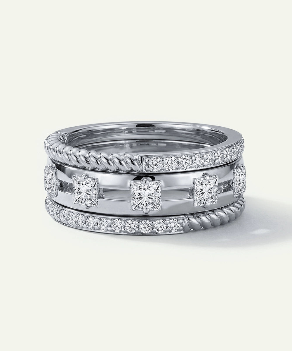 Two silver rings with diamond accents on a white background