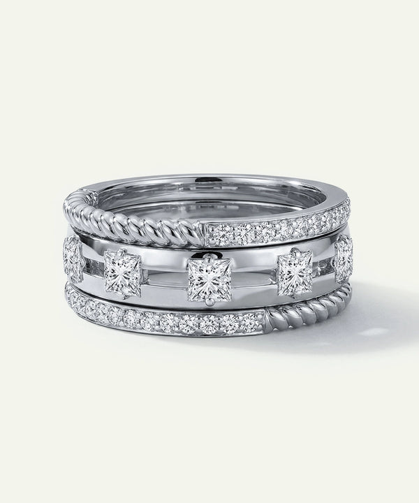 Two silver rings with diamond accents on a white background