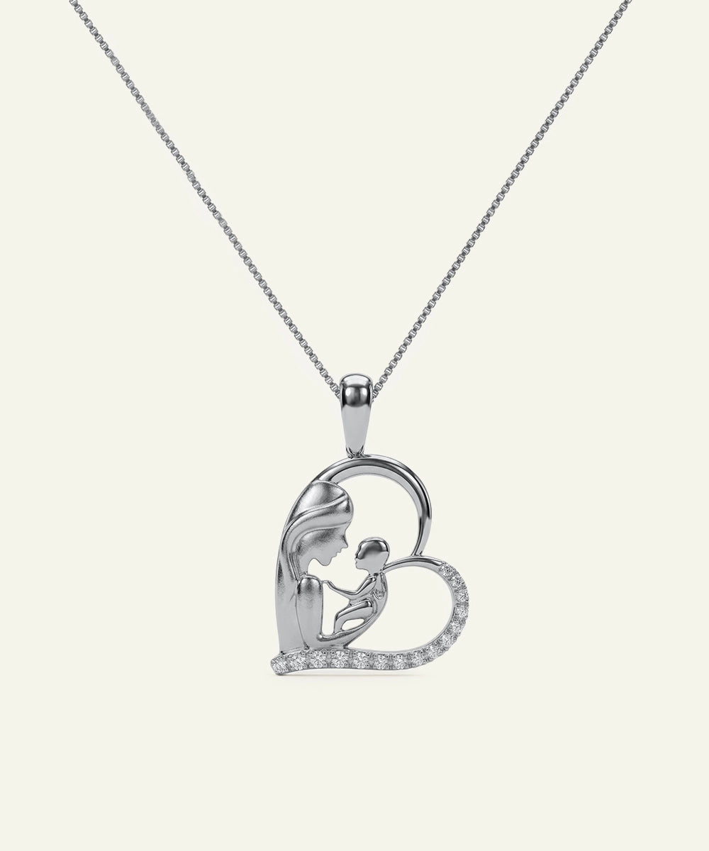 Silver necklace with a heart-shaped pendant on a white background