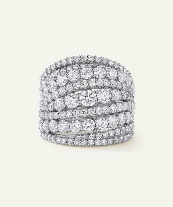 Stack of diamond rings on a light gray background