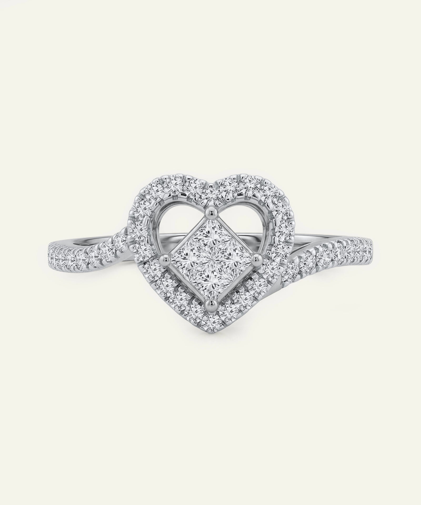 Diamond ring with heart design on a white background
