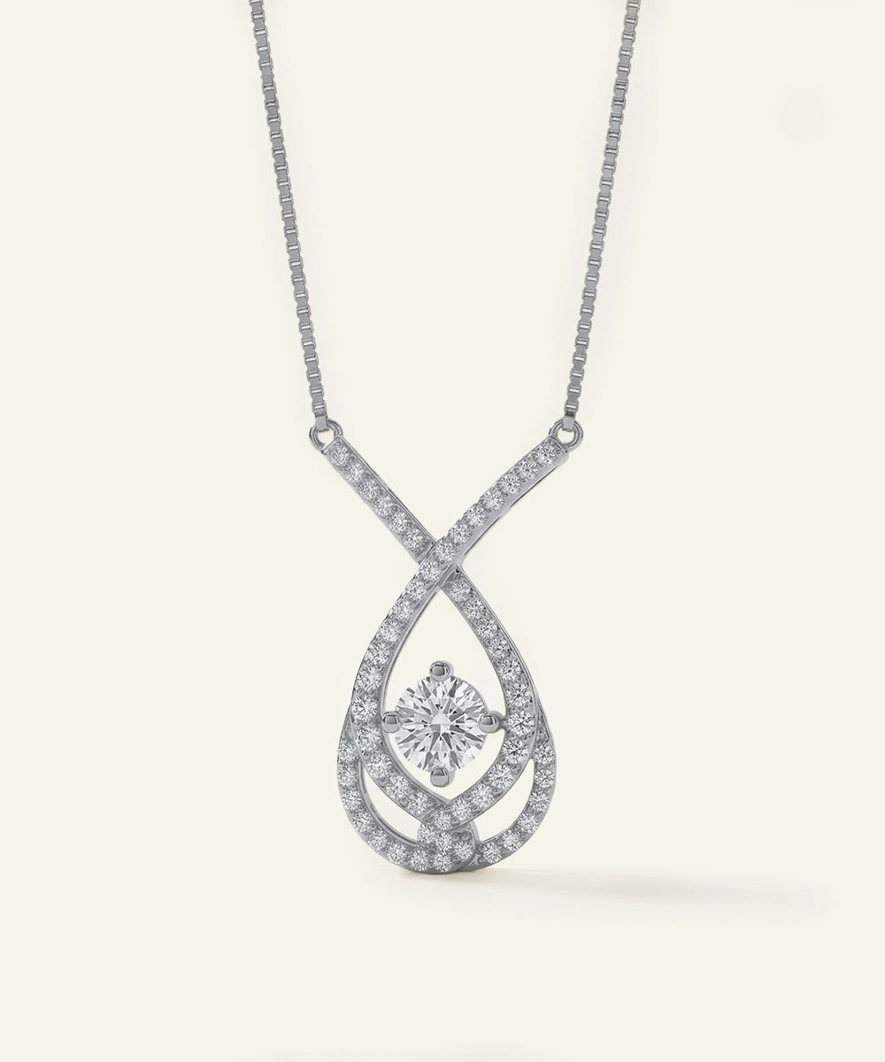 Diamond necklace with a teardrop pendant on a white background