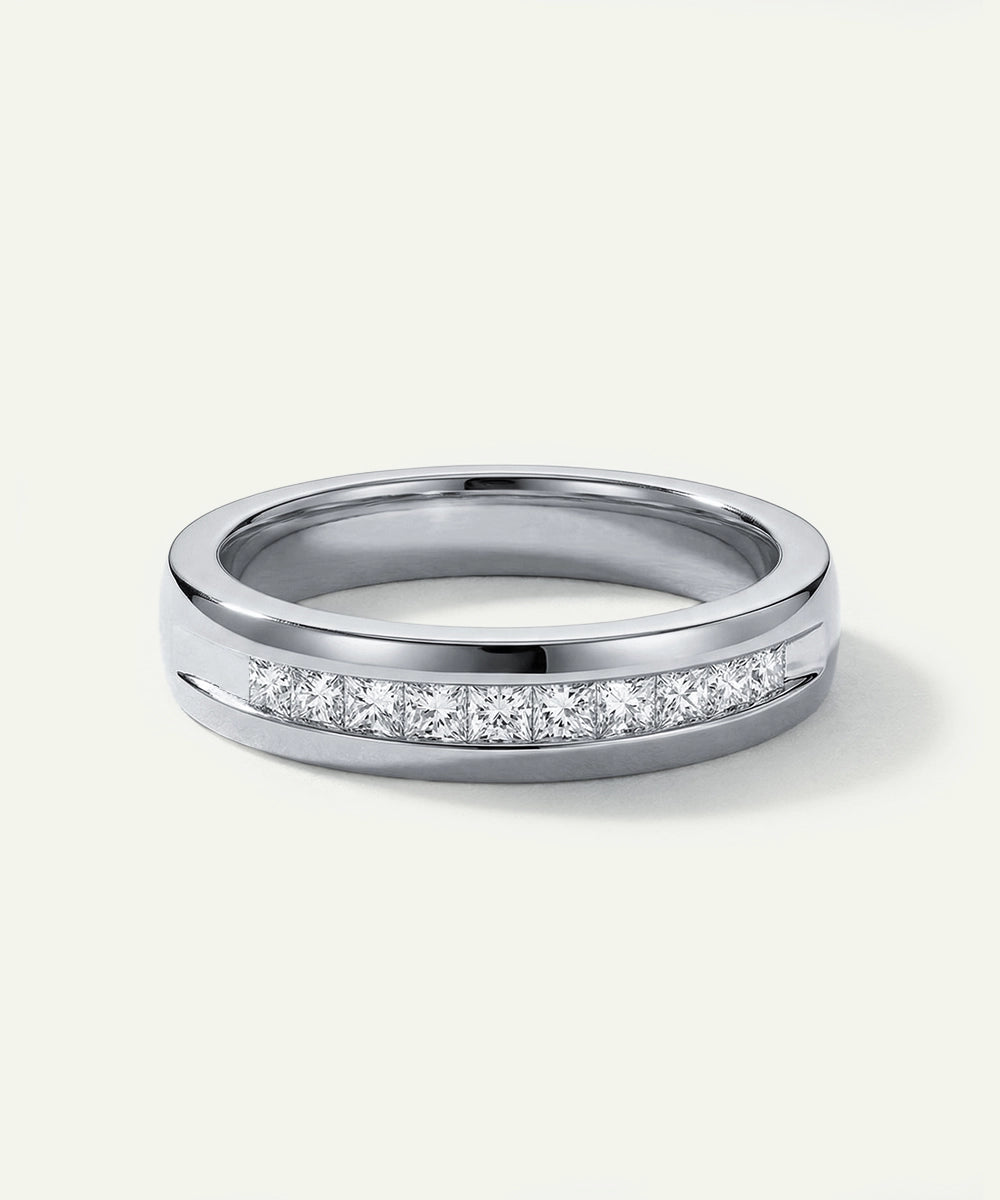 Silver ring with small diamonds on a white background