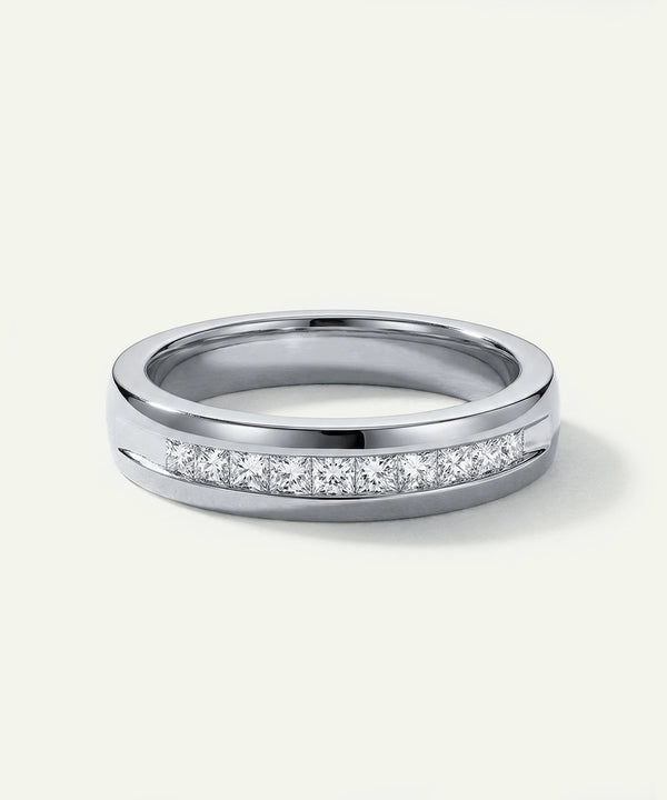 Silver ring with small diamonds on a white background