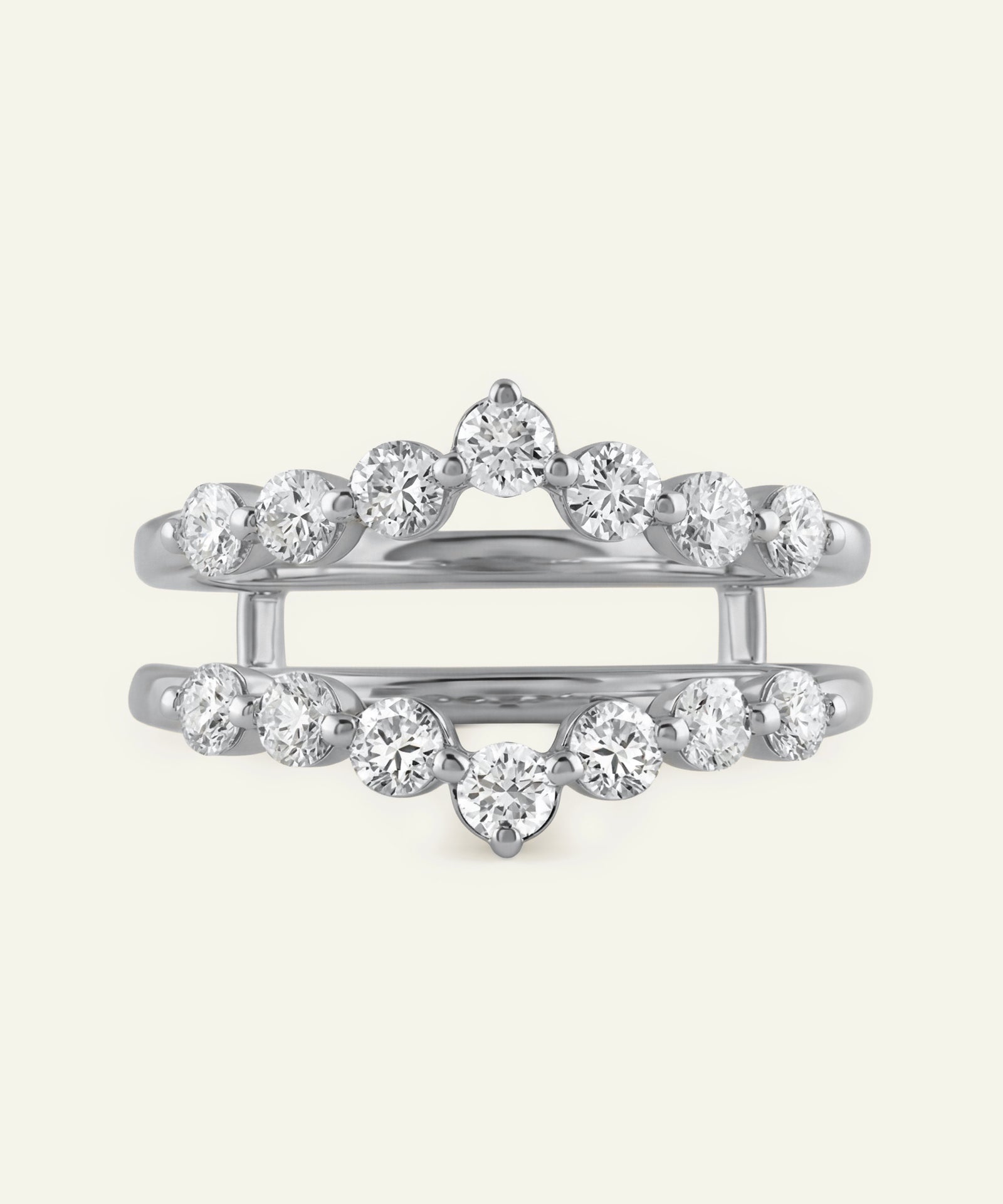 Silver ring with multiple diamonds on a white background